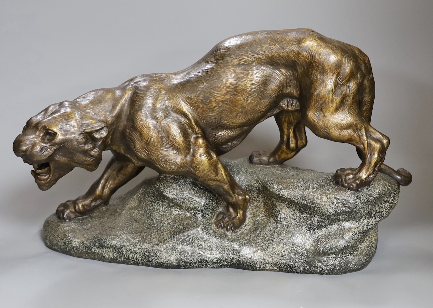 After Thomas François Cartier (1879-1943) patinated spelter model of a tiger, 49cm long